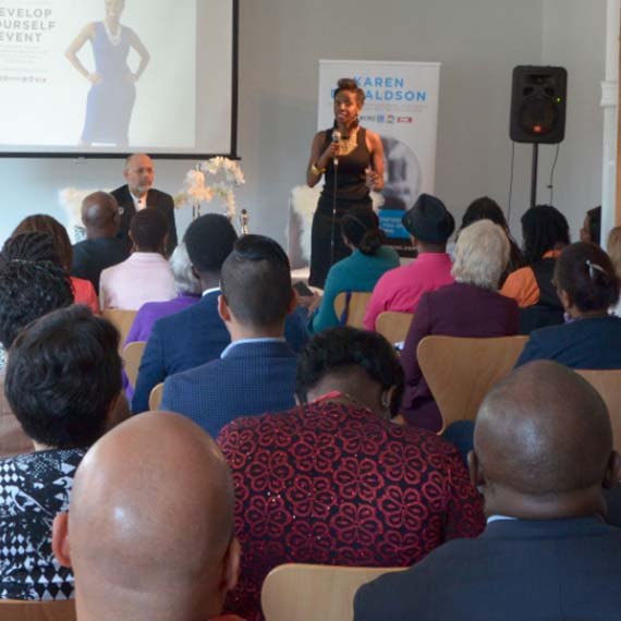 Karen speaking to a seated audience